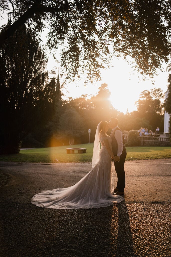 Bride and Groom admiring the sunset at Court Coleman - Bridgend Wedding Photographer